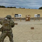 Soldier wearing Redemption Tactical CRUSADER 2.0 plate carrier at shooting range with standard 10x12 plate