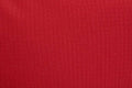 Solid red fabric with woven texture on a Firefighter Turnout Gear Bag featuring water resistant outer fabric