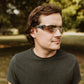 Sporty METEL M50 Safety Glasses with gradient lenses worn in a dark t-shirt