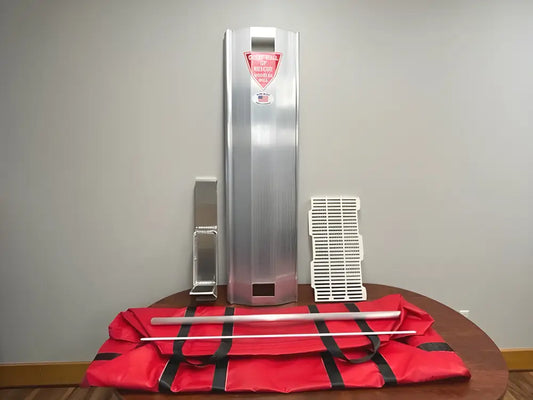 Stainless steel water dispenser with pink top on red mat for Grain Entrapment Rescue System