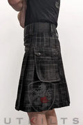 Black and grey plaid utility kilt with cargo pockets in Highlander Gray Tartan design