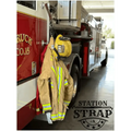 Firefighter turnout gear with reflective stripes on a hook, featuring Station Strap Leather
