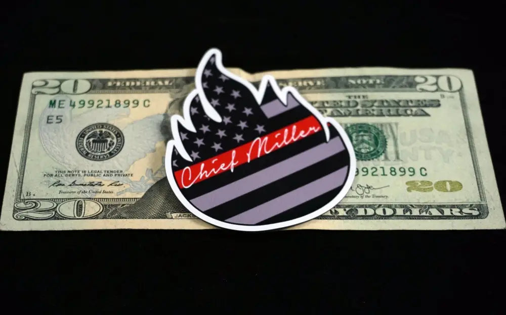 Chief Miller Decal on a twenty dollar bill with a striking black and white flame design