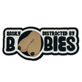 Easily distracted design with cartoon dog nose on Fun Size Boobs 4 inch PVC patch