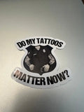 Sticker of tattooed police figure asking if tattoos matter for first responders