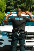 Police officer in uniform promoting mental health while wearing stigma-breaking unisex tee
