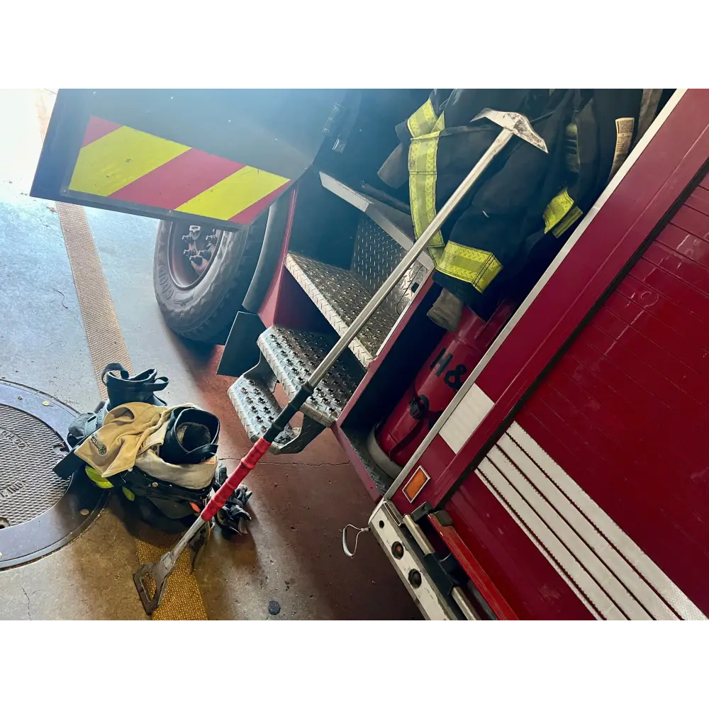 Red fire truck with emergency tools highlighting Stitch Hook and spade tip features