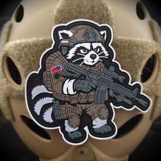 Cartoon tactical raccoon patch from Street Cat Collection featuring a trash panda with rifle