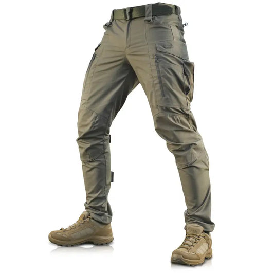 Olive green M-Tac Tactical Pants Conquistador Gen I Flex with pockets and combat boots