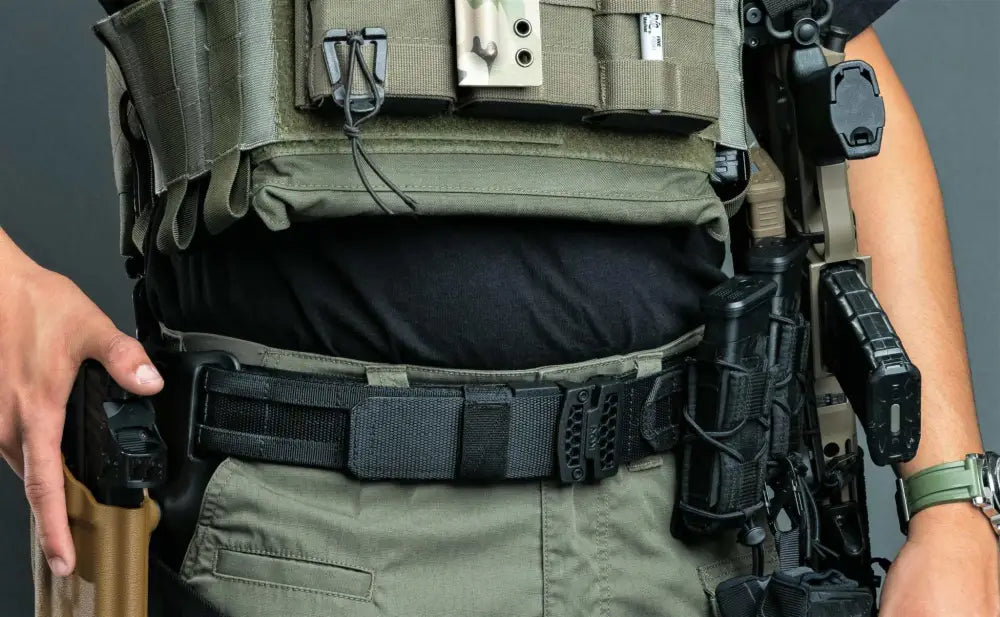 Tactical duty belt with holstered firearm and pouches in Ranger Green color