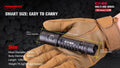 Tactical flashlight with tan glove showcasing dimensions of E11-G2 1300 Lumen Rechargeable EDC Flashlight