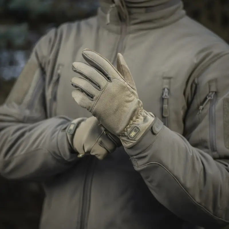 Tactical glove adjustment on gray jacket, featuring M-Tac Gloves Scout Tactical design