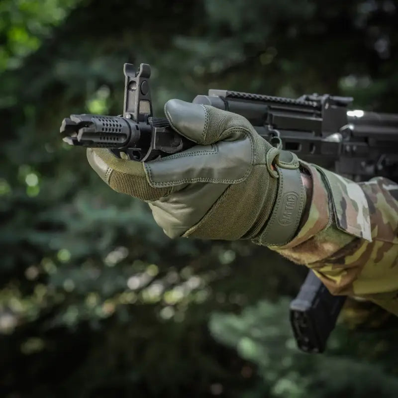 Tactical gloved hand gripping black rifle showcasing M-Tac Gloves Police Gen.2