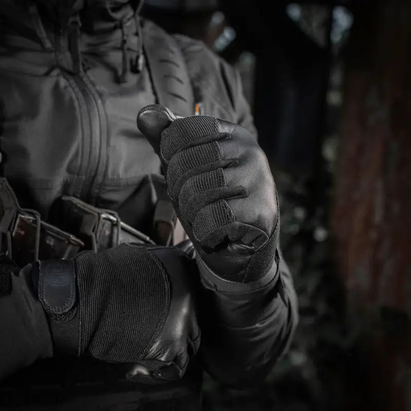 Tactical gloved hands holding a weapon showcasing M-Tac Gloves Police Gen.2 features