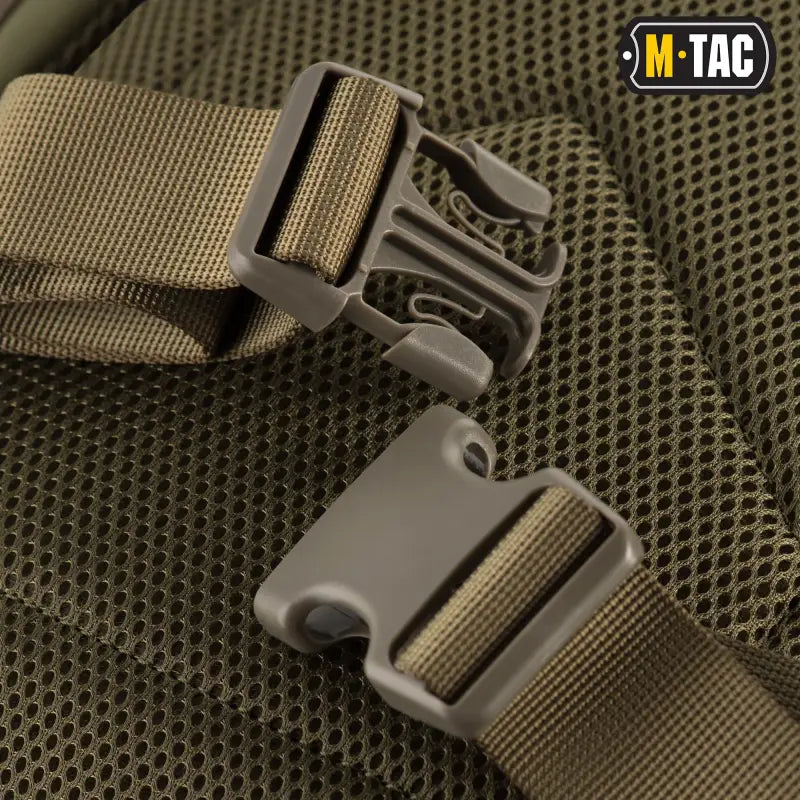 Tactical plastic buckle with olive webbing on M-Tac Assault Pack with large compartments