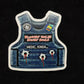 Tactical vest patch with bullet holes and blood spatter design from Bullet Proof Medic