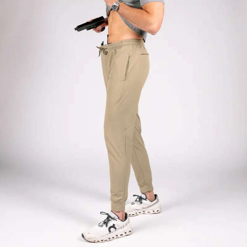 Tan athletic traveler joggers with concealed carry carrier retention waistband for active comfort