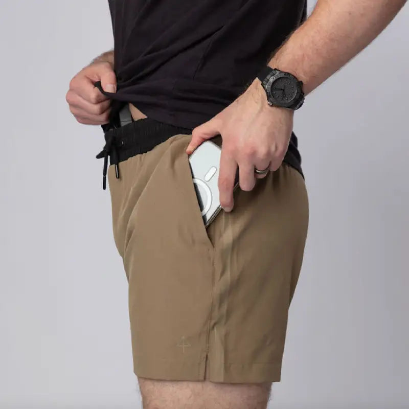 Tan athletic training shorts from Carrier Training Shorts Mk.II with 5-inch inseam for concealed carry