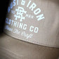 Tan Dirtbag Trucker Hat featuring Rust & Iron Classic Logo embroidery