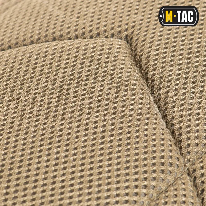 Tan mesh fabric with tiny holes for M-Tac Assault Pack’s large main zippered compartments