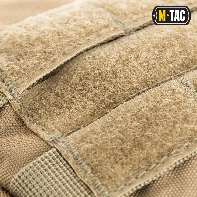 Tan Velcro strips on M-TAC Assault Pack with large main zippered compartments