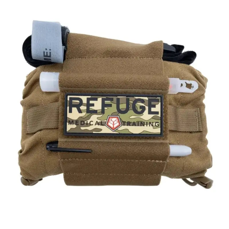 Coyote Tan tactical medical pouch with REFUGE patch and supplies for OPFAK week lead-time