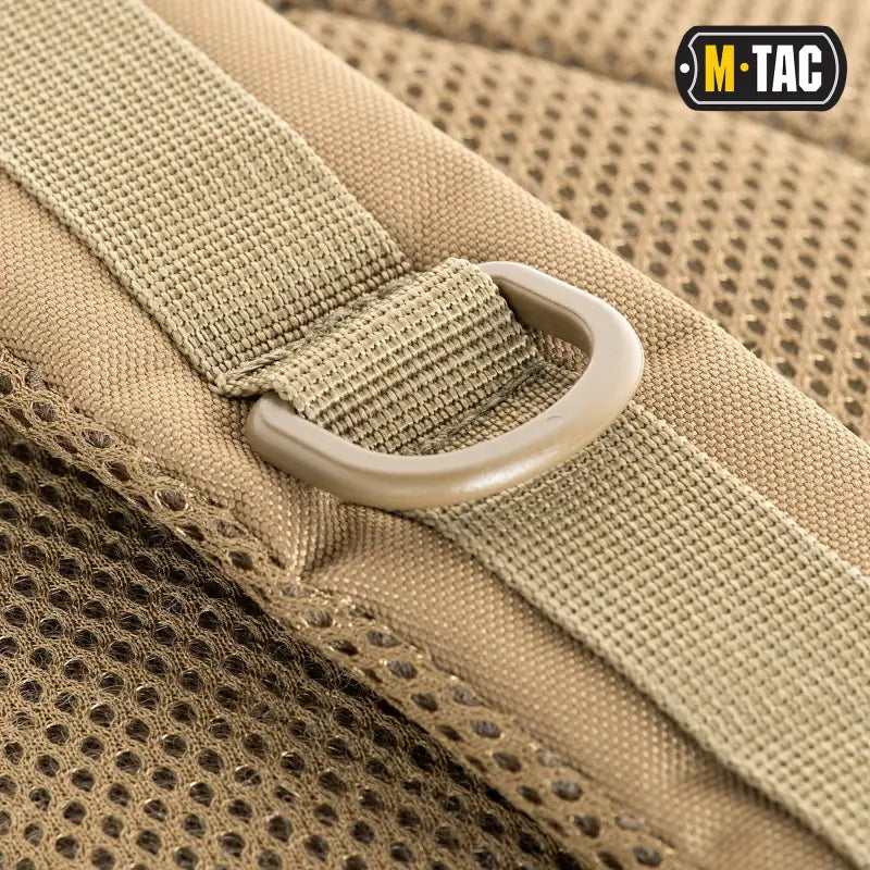 Tan tactical D-ring strap with mesh on M-Tac Assault Pack featuring large compartments