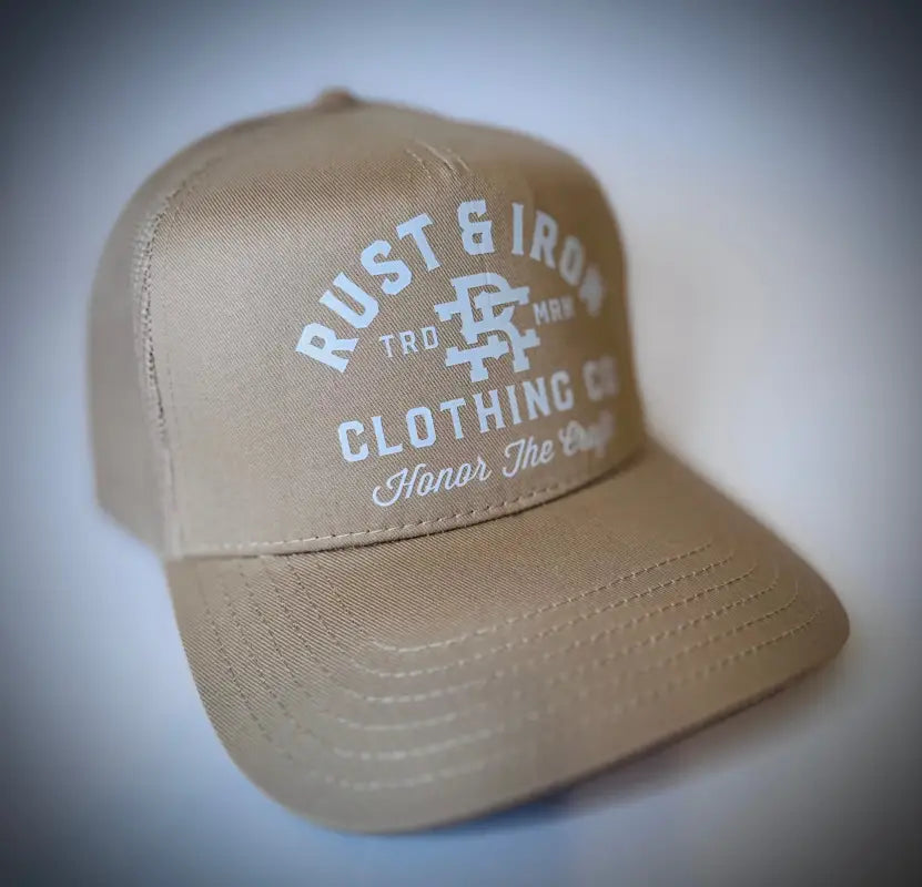 Tan Dirtbag Trucker Hat featuring Rust & Iron Classic Logo in white lettering