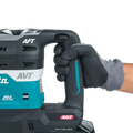 Teal and black Makita GRH05M1 40V max XGT® Brushless AVT® Rotary Hammer in gloved hand