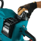 Teal Makita GEC01PL4 80V cordless chainsaw with electric brake and battery in use