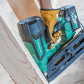 Teal-colored Metabo HPT 372121M cordless nail gun with battery in use by gloved hand