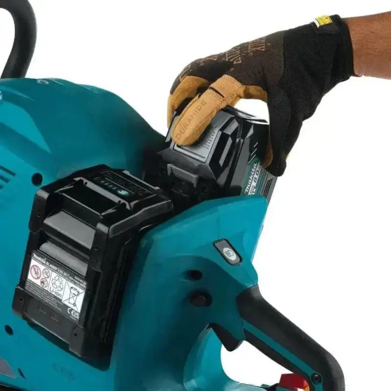 Teal cordless Makita GEC01PL 80V XGT power tool with black battery in gloved hand