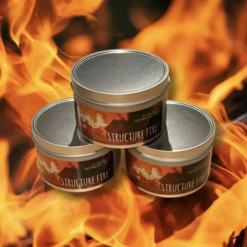 Three silver metal tins labeled Structure Fire scented candle for first responders and firefighters