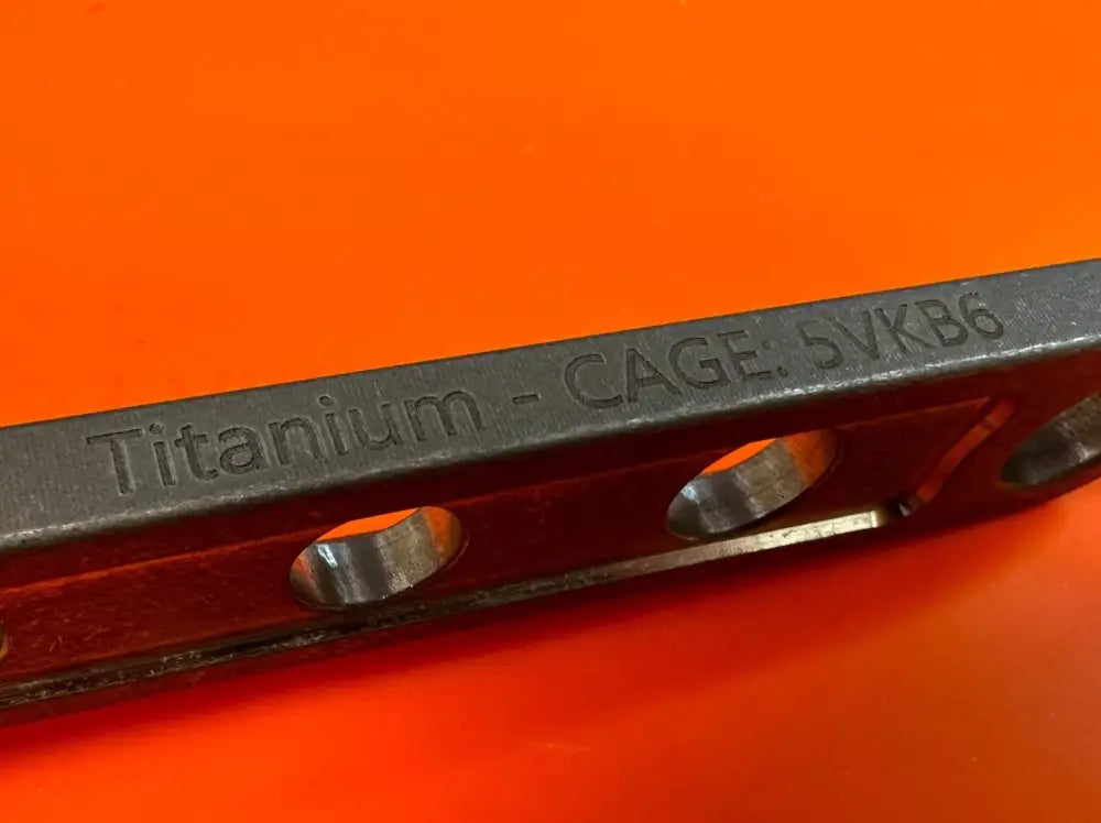 Titanium metal component with drilled holes for a lightweight corrosion resistant adjustable wrench