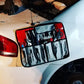 Tool roll attached to a car from the Crash Bag Kit Standard for roadside emergency use