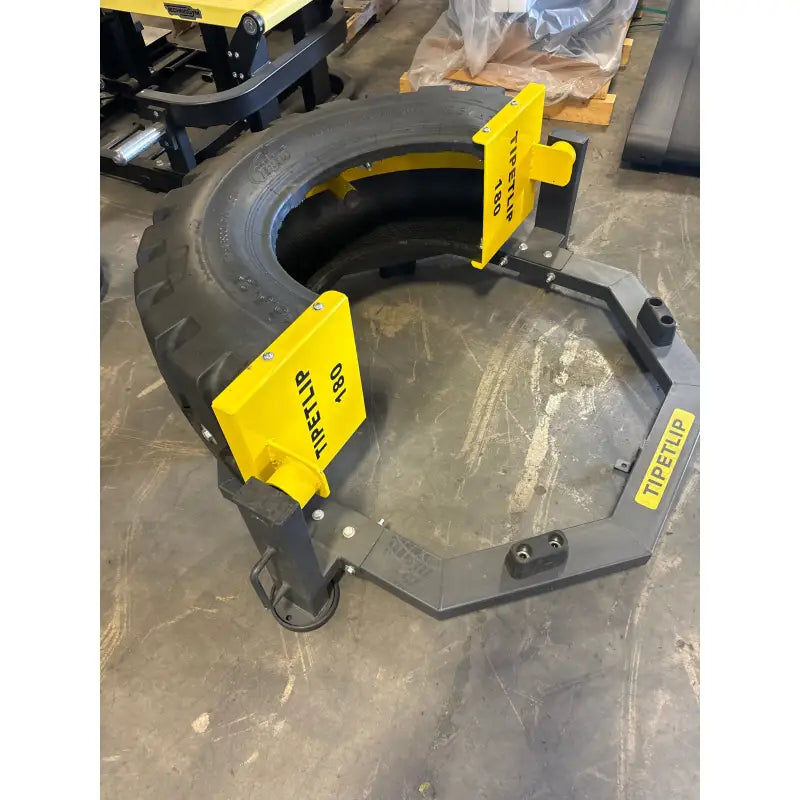 Tire-handling tool with yellow clamps for the SFE Tire Flip for easy tire flips