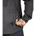 Hand accessing zippered pocket on Tradecraft Tactical Jacket for level IIIA body armor