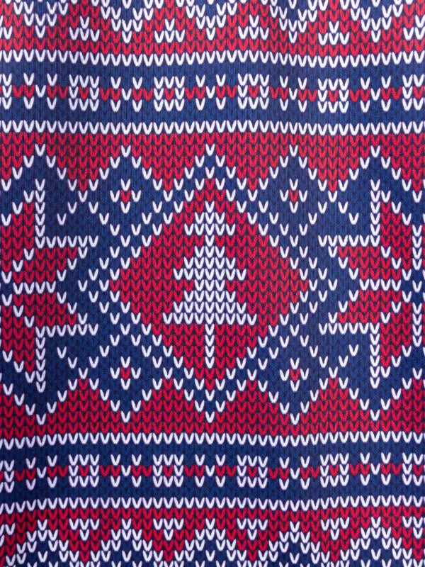 Traditional Nordic knit pattern in red, white, and navy on Women’s Fit Ugly Holiday Sweater Scrub Top