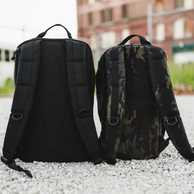 Two backpacks, one black and one camouflage, showcasing the 24hr Ranger Green design