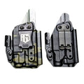 Two black Kydex light bearing IWB holsters with belt clips and retention mechanisms