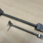 Two black metal door stops with adjustable lengths for the Hooligan Forced Entry Tool