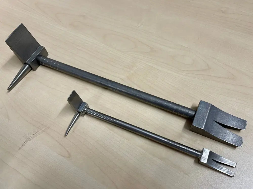 Two black metal door stops with adjustable lengths for the Hooligan Forced Entry Tool