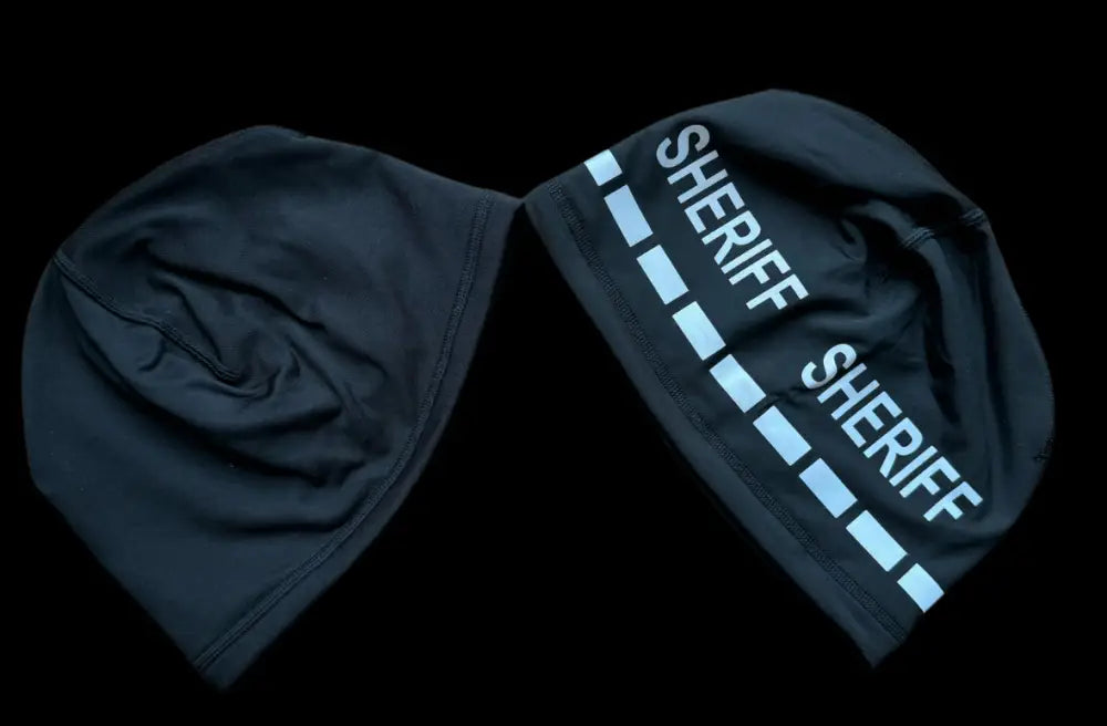 Reversible black sheriff beanies for police and first responders featuring firefighter style
