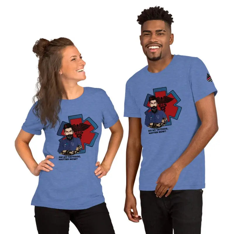 Two people in matching heather prism dusty blue t-shirts with a cartoon EMT design