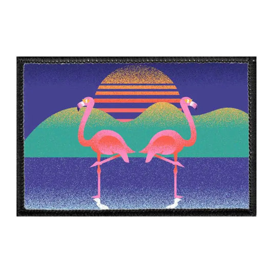 Two pink flamingos at sunset on an 80’s Flamingo removable patch for velcro® loop surface