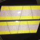 Reflective yellow grey triple stripe panels on Tetrahedron 8 pack helmet