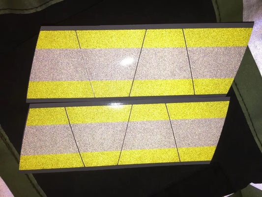 Reflective yellow grey triple stripe panels on Tetrahedron 8 pack helmet