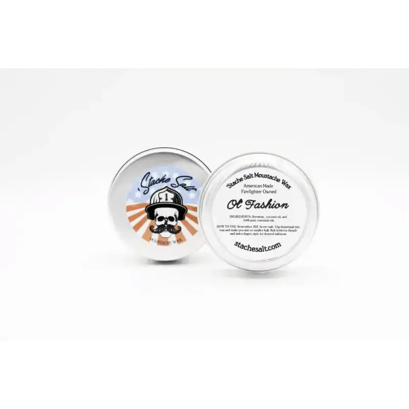 Two round white tins of Ol’ Fashion Light Hold Mustache Wax with skull logo