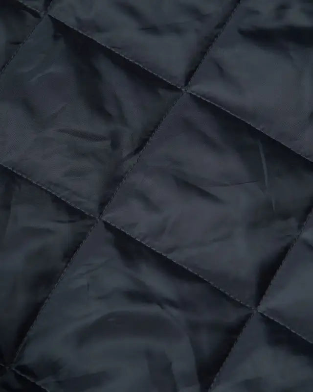 Dark quilted fabric with geometric stitching for UHV562 HiVis Quilt Lined Bomber Jacket