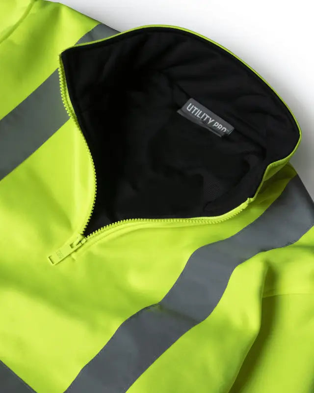 High-visibility yellow UHV667 HiVis Women’s 1/4 Zip Soft Shell jacket for job site warmth